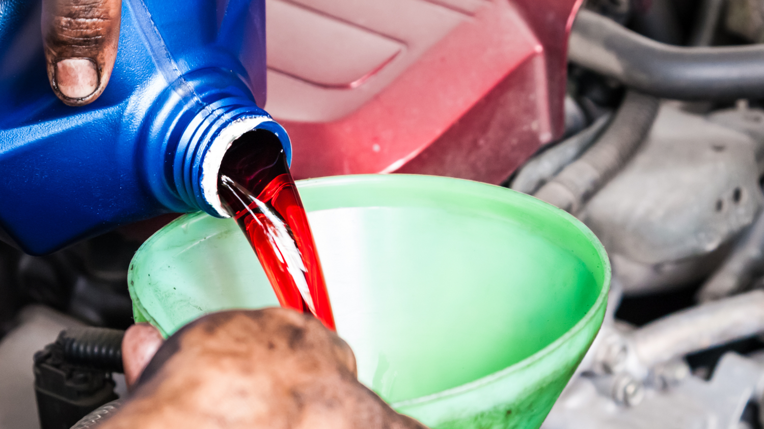 CVT fluid being poured during transmission service