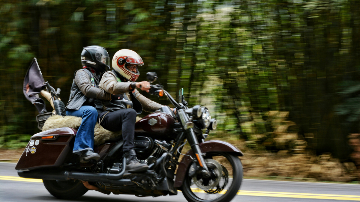 Motorcycle riders on a fuel-powered bike