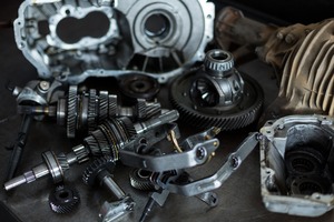 automotive gear parts sitting on a shop work bench